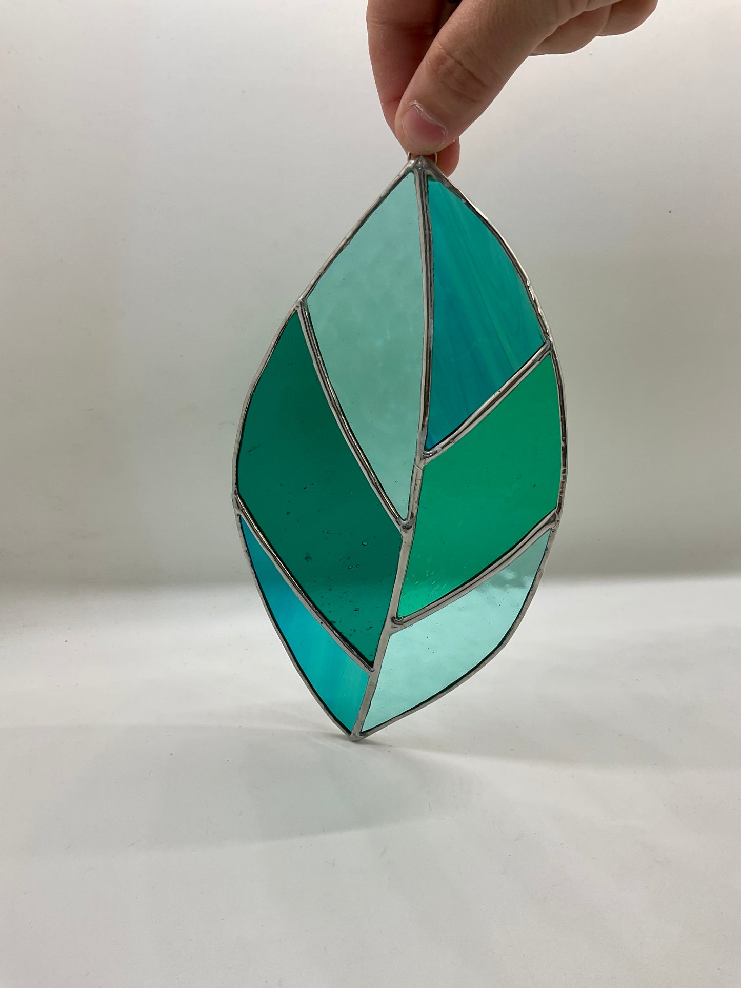 Teal/green leaf suncatcher